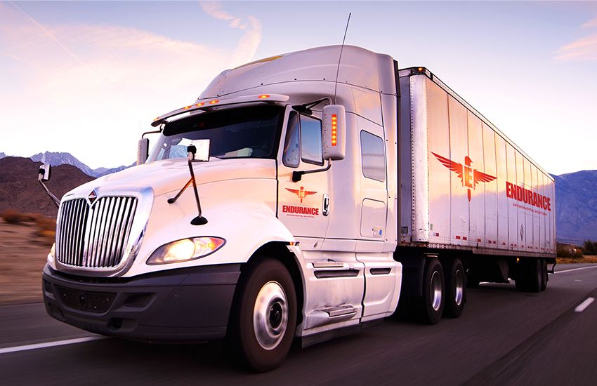 Endurance Environmental Solutions semi-truck driving on highway at dusk